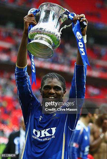 Nwankwo Kanu of Portsmouth celebrates with the trophy following the FA Cup Final sponsored by E.ON between Portsmouth and Cardiff City at Wembley...