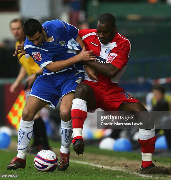 Gary Dicker of Stockport and Leon Johnson of Wycombe challenge for the ball during the League Two Playoff Semi Final match between Stockport County...