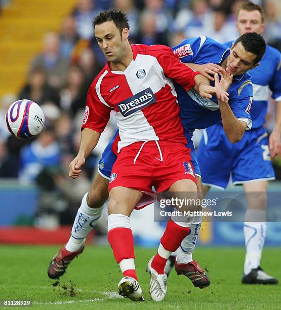 Gary Dicker of Stockport and Stefan Oakes of Wycombe challenge for the ball during the League Two Playoff Semi Final match between Stockport County...