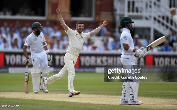 Mark Wood celebrates dismissing Jean-Paul Duminy of South Africa during the 4th day of the 1st Investec Test between England and South Africa at...