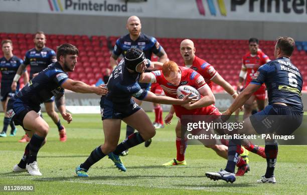 Salford Red Devils' Josh Wood drives to the line to score a try against Leeds Rhinos, during the Betfred Super League match at the AJ Bell Stadium,...