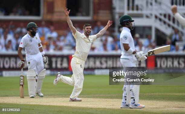 Mark Wood celebrates dismissing Jean-Paul Duminy of South Africa during the 4th day of the 1st Investec Test between England and South Africa at...