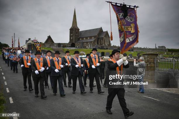 Members of the Orange Order hold a prayer service during their weekly protest at Drumcree Church on July 9, 2017 in Drumcree, Northern Ireland. The...