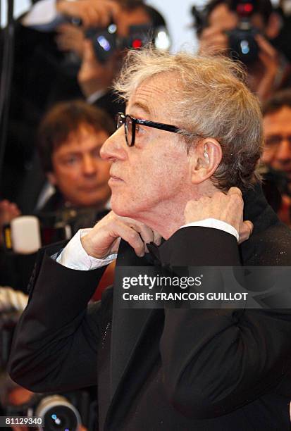 Director Woody Allen adjust his jacket as he arrives to attend the screening of his film 'Vicky Cristina Barcelona' at the 61st Cannes International...