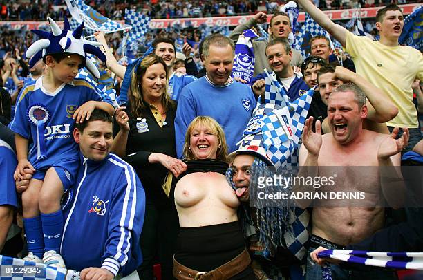 Portsmouth fans celebrate their victory after winning The F.A Cup after beating Cardiff City in the final at Wembley Stadium in London on May 17,...