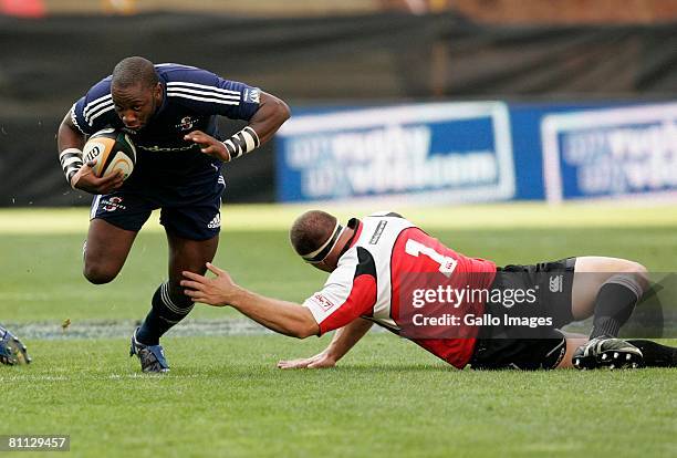 Gcobani Bobo of the Stormers beats Heinke van der Merwe of the Lions during the Super 14 match between Lions and the Stormers. The game was won 22-13...