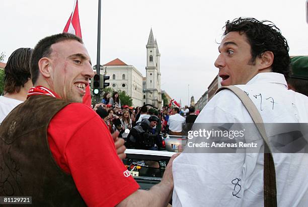 Franck Ribery and Luca Toni of Munich celebrate during a car convoy at Leopold Street during the Bundesliga match between FC Bayern Munich and Hertha...