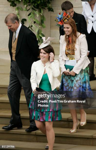 Prince Andrew, the Duke of York walks with daughters Princess Eugenie and Princess Beatrice at the wedding of Peter Phillips to Autumn Kelly, at St...