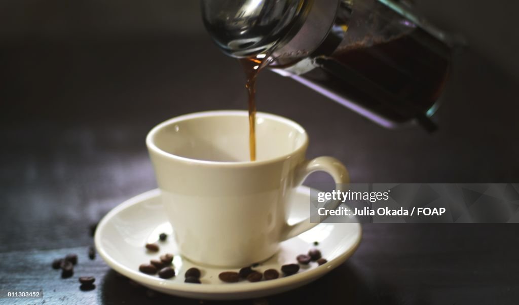 Coffee pouring in to coffee cup