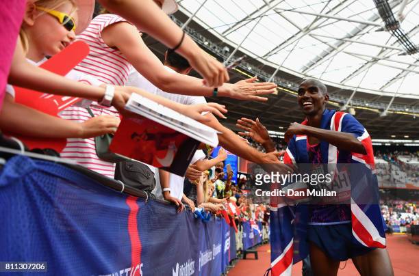 Mo Farah of Great Britain celebrates with fans after he won the Mens 3000m during the Muller Anniversary Games at London Stadium on July 9, 2017 in...