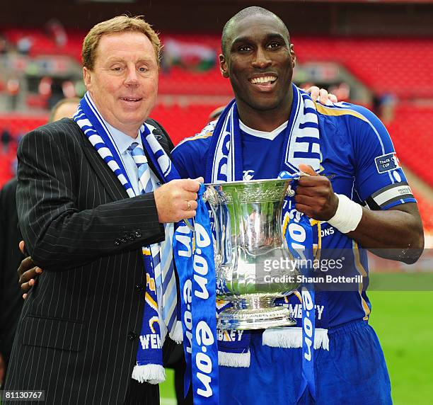 Harry Redknapp manager of Portsmouth lifts the trophy with Sol Campbell following the FA Cup Final sponsored by E.ON between Portsmouth and Cardiff...