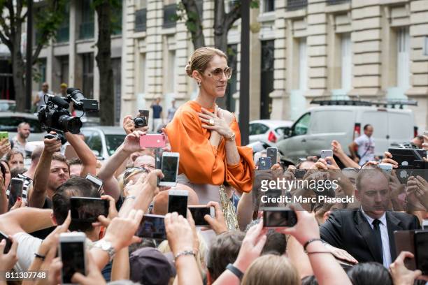 Singer Celine Dion is surrounded by french fans as she leaves the 'Royal Monceau' hotel on Avenue Hoche on July 9, 2017 in Paris, France.