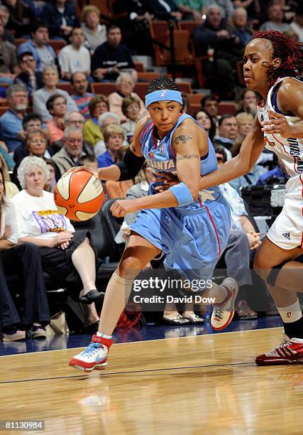 Betty Lennox of the Atlanta Dream drives against the Connecticut Sun during the WNBA game on May 17, 2008 at the Mohegan Sun Arena in Uncansville,...