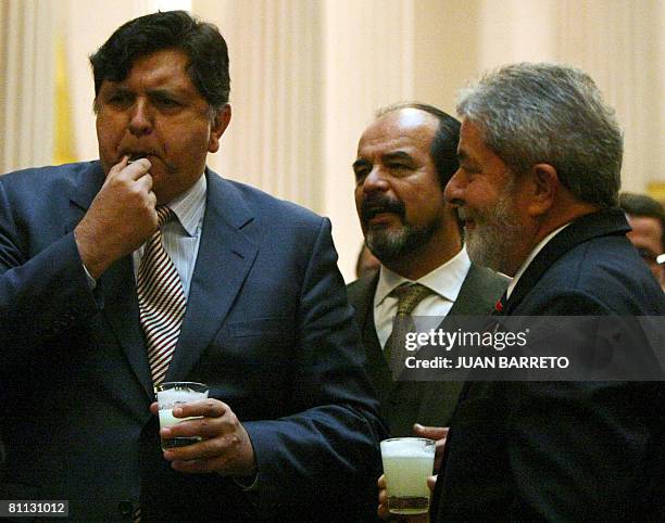 Brazilian President, Luiz Inacio Lula Da Silva , shares a typical "Pisco Sour" drink with his Peruvian counterpart, Alan Garcia , after meeting at...