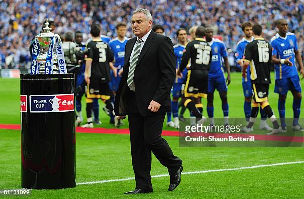 Dave Jones manager of Cardiff City walks past the trophy prior to the FA Cup Final sponsored by E.ON between Portsmouth v Cardiff City at Wembley...