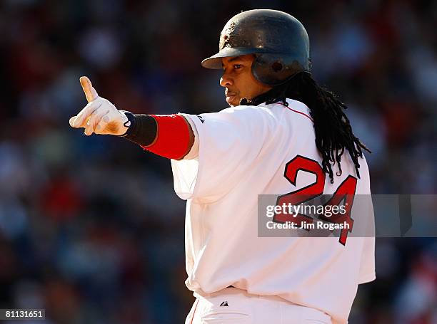 Manny Ramirez of the Boston Red Sox connects for a single against the Milwaukee Brewers at Fenway Park on May 17, 2008 in Boston, Massachusetts.