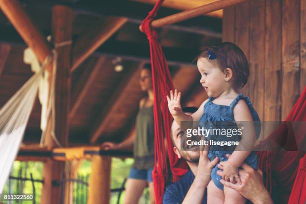 millennial parents together - child saluting stock pictures, royalty-free photos & images