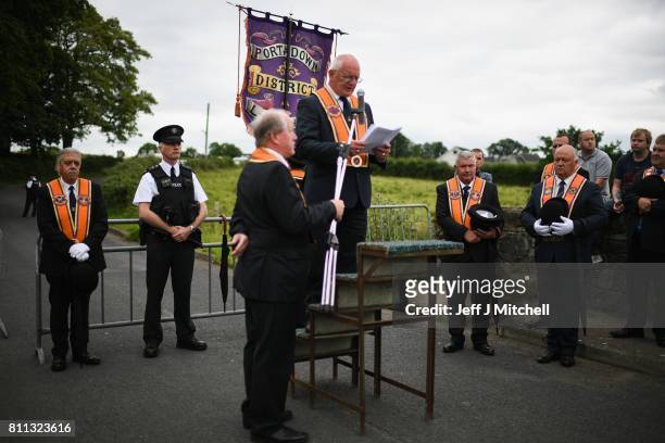 Members of the Orange Order hold a prayer service during their weekly protest at Drumcree Church on July 9, 2017 in Drumcree, Northern Ireland. The...