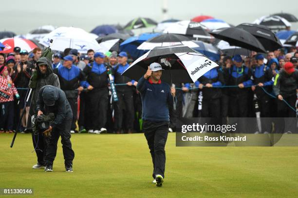 Jon Rahm of Spain acknowledges the crowd on the 18th hole during the final round of the Dubai Duty Free Irish Open at Portstewart Golf Club on July...