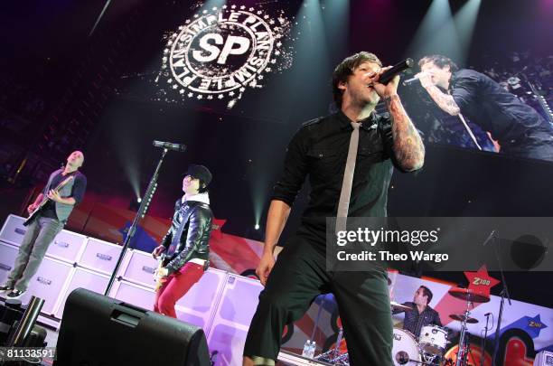 Musicians Jeff Stinco, Sebastian Lefebvre, Pierre Bouvier, Chuck Cameau of Simple Plan perform onstage during Z100's Zootopia at the IZOD Center on...