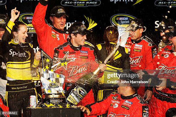 Kasey Kahne, driver of the Budweiser Dodge, celebrates with crew members in victory lane after winning the NASCAR Sprint All-Star Race on May 17,...