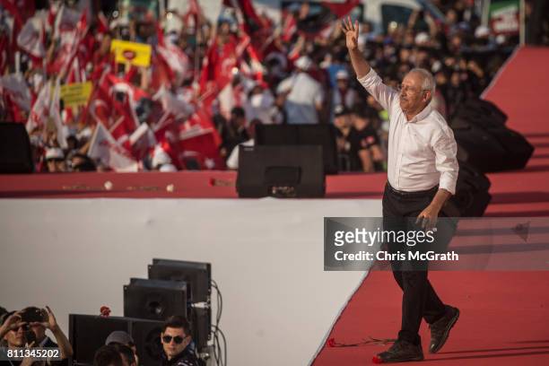 Turkey's main opposition Republican People's Party leader Kemal Kilicdaroglu waves to the crowd after speaking on stage to thousands of supporters...