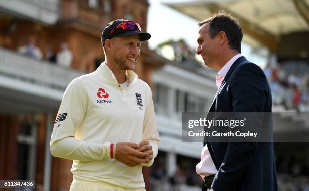 England captain Joe Root speaks with former captain Michael Vaughan after winning the 1st Investec Test between England and South Africa at Lord's...