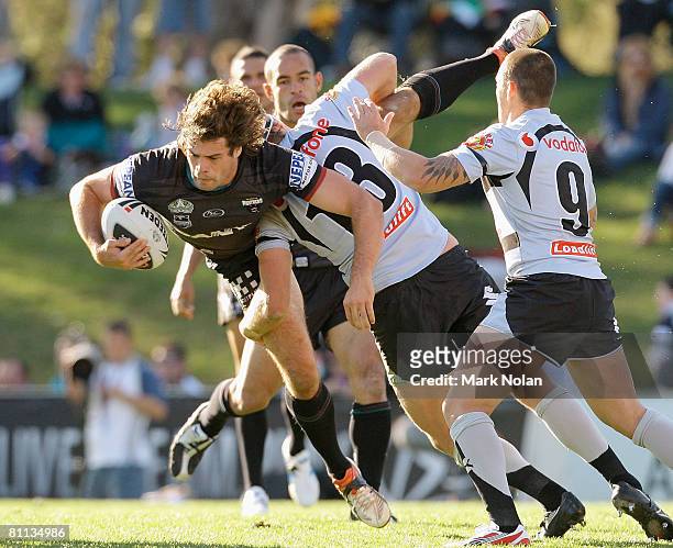 Matthew Bell of the Panthers is tackled during the round 10 NRL match between the Penrith Panthers and the Warriors at CUA Stadium on May 18, 2008 in...