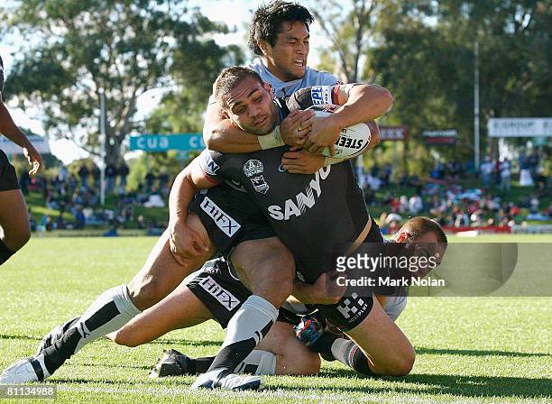 Maurice Blair of the Panthers is tackled during the round 10 NRL match between the Penrith Panthers and the Warriors at CUA Stadium on May 18, 2008...