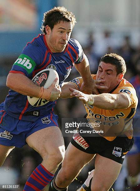 Chris Bailey of the Knights runs the ball during the round 10 NRL match between the Newcastle Knights and the Wests Tigers at EnergyAustralia Stadium...