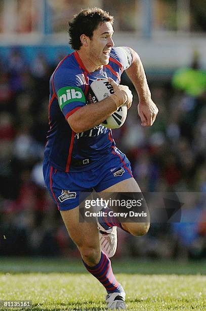 Chris Bailey of the Knights runs the ball during the round 10 NRL match between the Newcastle Knights and the Wests Tigers at EnergyAustralia Stadium...