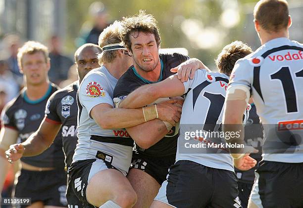 Trent Waterhouse of the Panthers is tackled during the round 10 NRL match between the Penrith Panthers and the Warriors at CUA Stadium on May 18,...