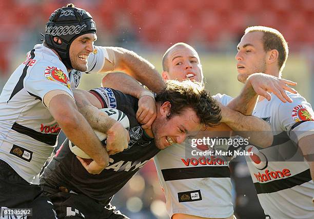 Trent Waterhouse of the Panthers is tackled during the round 10 NRL match between the Penrith Panthers and the Warriors at CUA Stadium on May 18,...