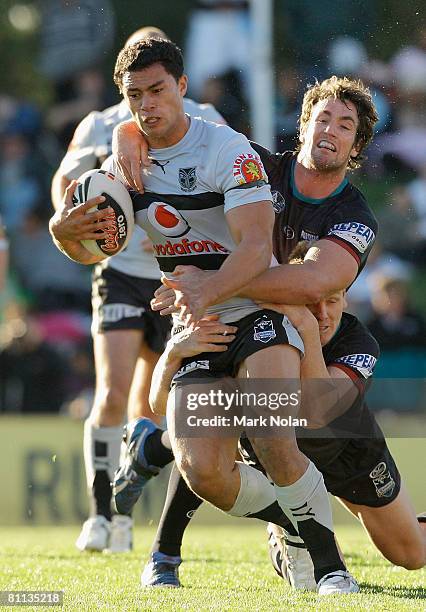 Sonny Fai of the Warriors is tackled during the round 10 NRL match between the Penrith Panthers and the Warriors at CUA Stadium on May 18, 2008 in...