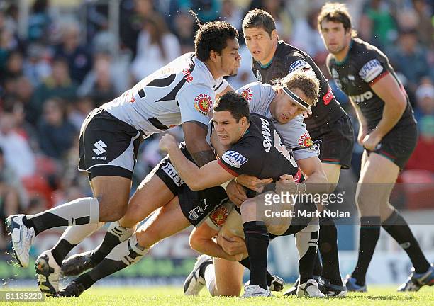 Michael Gordon of the Panthers is tackled during the round 10 NRL match between the Penrith Panthers and the Warriors at CUA Stadium on May 18, 2008...