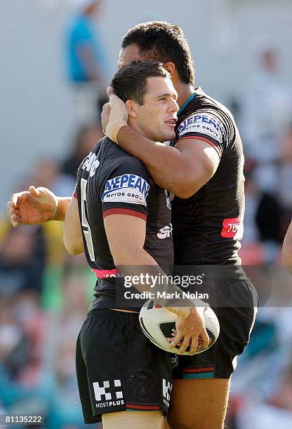 Michael Gordon of the Panthers is congratulated by a team mate after scoring during the round 10 NRL match between the Penrith Panthers and the...