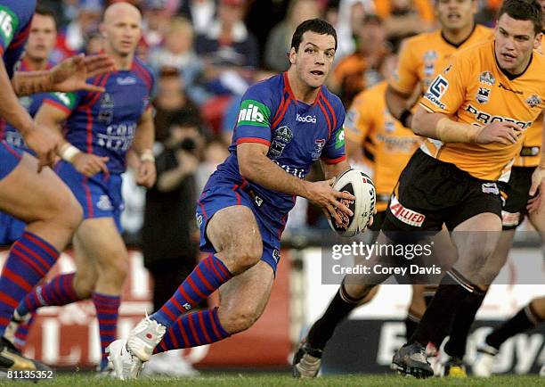 Jarrod Mullen of the Knights looks to pass during the round 10 NRL match between the Newcastle Knights and the Wests Tigers at EnergyAustralia...