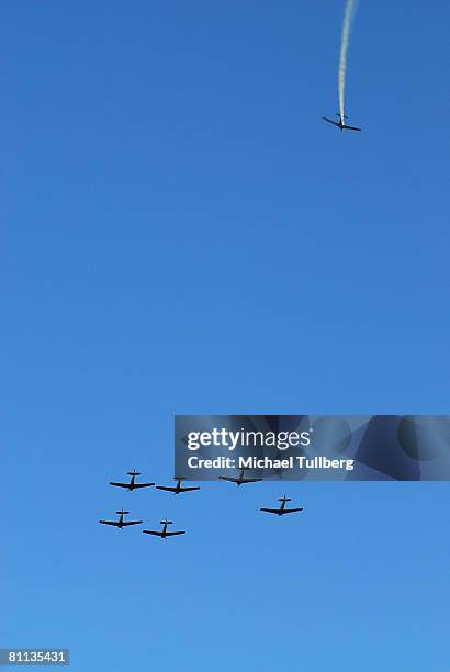 Pilots from The Condor Squad fly six vintage World War II warbirds in the 'missing man' formation in tribute to fallen veterans in a flyby over the...