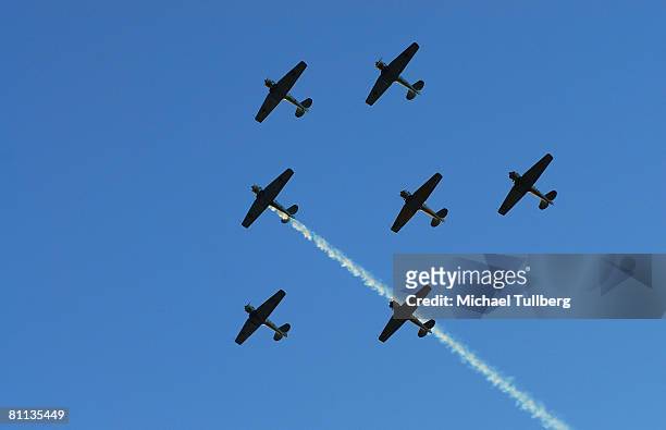 Pilots from The Condor Squad fly six vintage World War II warbirds in the 'missing man' formation in tribute to fallen veterans in a flyby over the...
