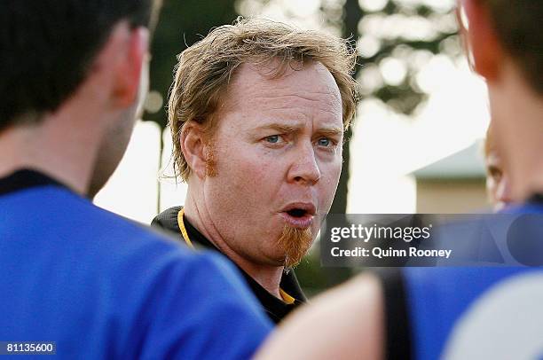 Simon Atkins the coach of the Tigers talks to his players during the round seven VFL match between Frankston and the Werribee Tigers at Frankston...