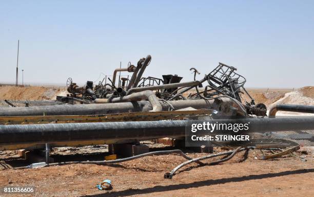 Picture taken on July 9, 2017 shows the damage at Syria's Arak gas field, 35 kilometres northeast of the ancient city of Palmyra, in the central...