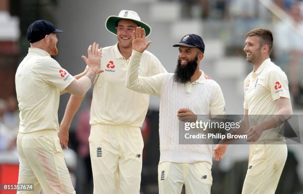 Moeen Ali of England is congratulated after the dismissal of Jean-Paul Duminy of South Africa during day four of the 1st Investec Test match between...