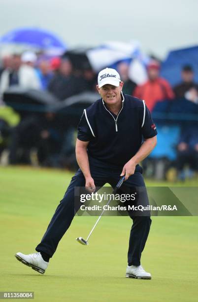 David Drysdale of Scotland holes a putt on the 18th green as he finishes his course record breaking round and also qualifying for The Open at Royal...