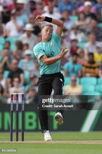 Tom Curran of Surrey bowls during the NatWest T20 Blast match at The Kia Oval on July 9, 2017 in London, England. .