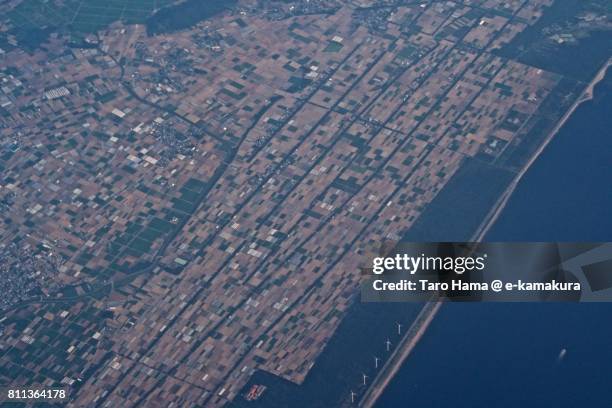 fields in tahara city in aichi prefecture daytime aerial view from airplane - atsumi stockfoto's en -beelden