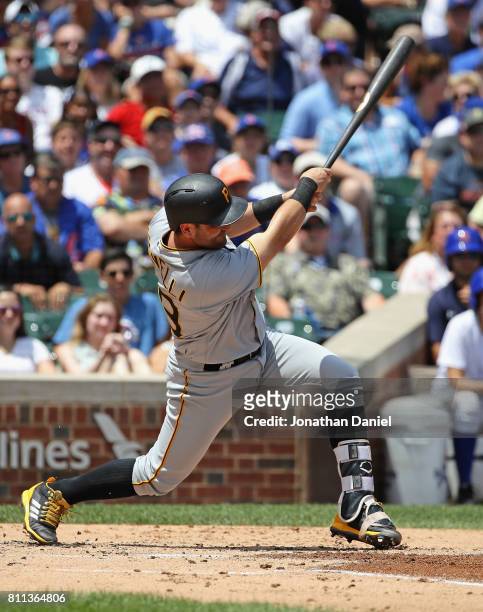 Francisco Cervelli of the Pittsburgh Pirates hits a grand slam home run in the 1st inning against the Chicago Cubs at Wrigley Field on July 9, 2017...