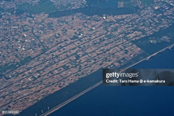 fields in tahara city in aichi prefecture daytime aerial view from airplane - atsumi stockfoto's en -beelden