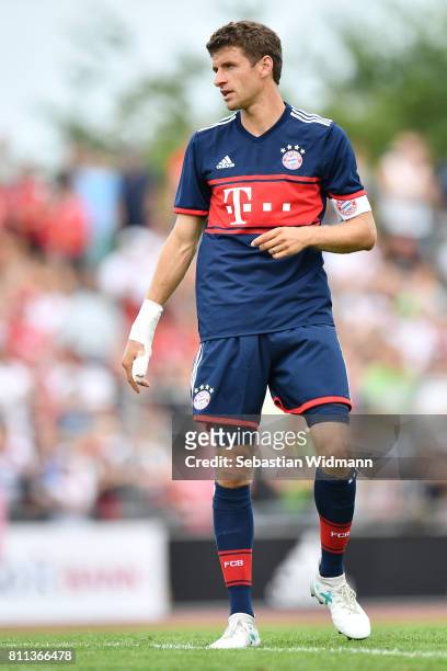 Thomas Mueller of FC Bayern Muenchen looks over his shoulder during the preseason friendly match between FSV Erlangen-Bruck and Bayern Muenchen at...