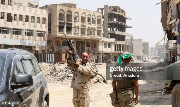 Iraqi security forces celebrate after Mosul completely freed from Daesh in Mosul, Syria on July 9, 2017. Mosul was captured by Daesh along vast...