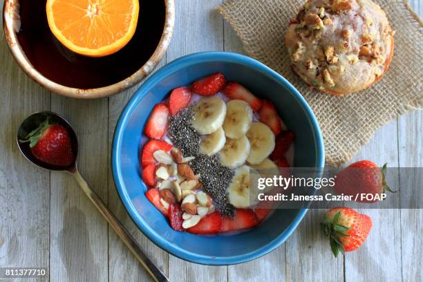 choped fruits in bowl - janessa stockfoto's en -beelden